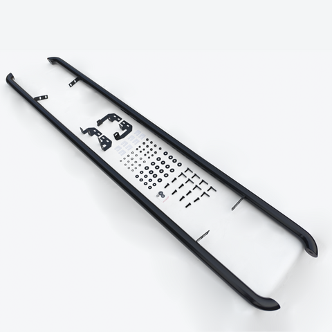 Two black rails rest parallel on a white surface, accompanied by assorted brackets, screws, washers, and hardware components organized between them.