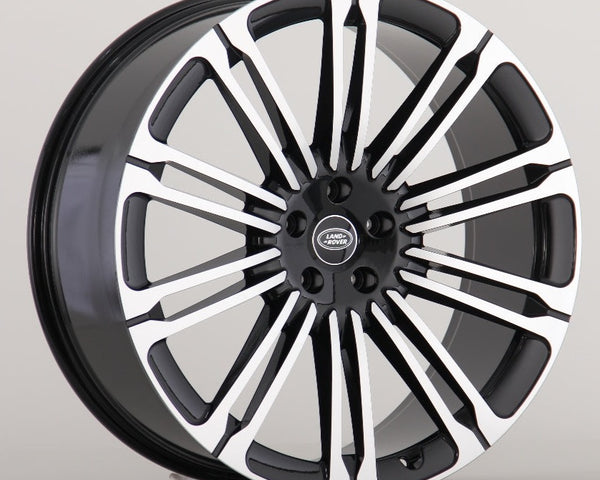 A multi-spoke alloy wheel with a black and silver finish, featuring the "Land Rover" logo at the center, is displayed against a plain background.