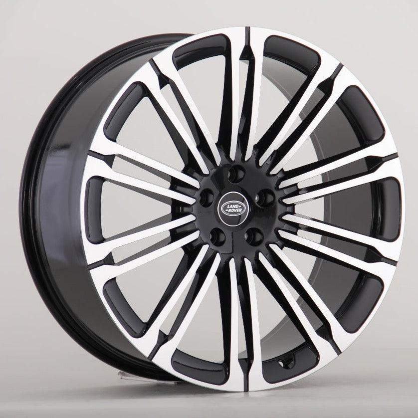 A multi-spoke alloy wheel with a black and silver finish, featuring the "Land Rover" logo at the center, is displayed against a plain background.