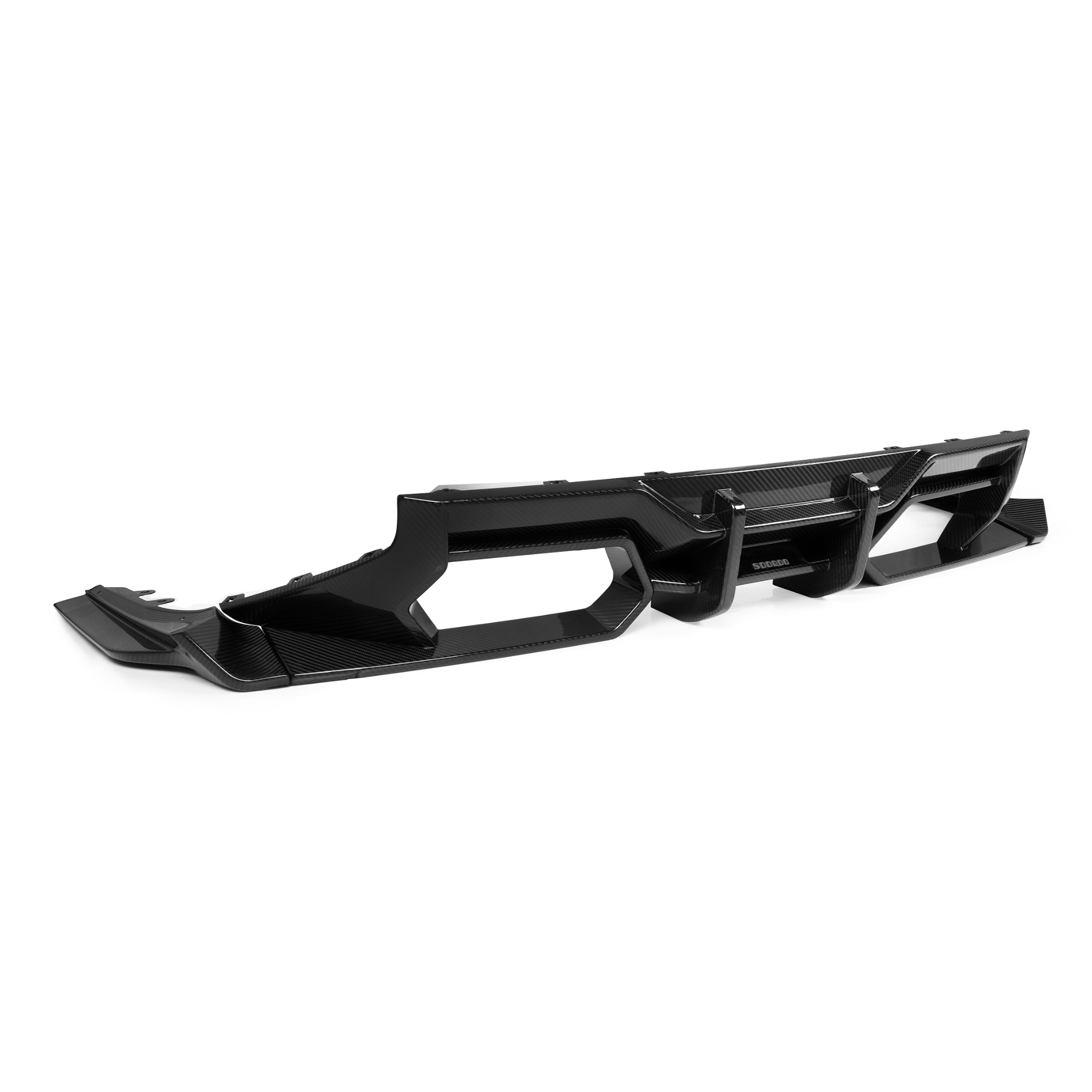 A sleek, black automotive diffuser with angular openings rests on a plain white background, highlighting its futuristic design and glossy carbon fiber texture.