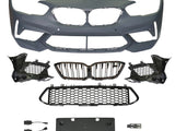 A collection of automotive parts includes a bumper cover, radiator grilles, and mounting brackets arranged on a plain background, suggesting components for vehicle front-end assembly.