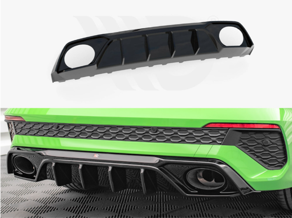 A black car diffuser with large circular cutouts and vertical fins is displayed separately and installed on a green car's rear bumper, providing aerodynamic enhancement in an automotive setting.