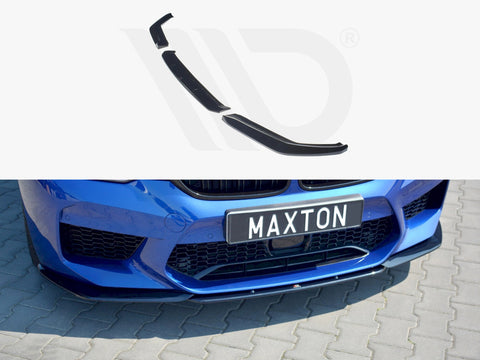 Car splitter attached to the front bumper of a blue vehicle parked on a gray cobblestone surface. Text on the license plate reads “MAXTON.”