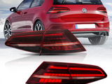 A red car is parked on a snowy landscape, showcasing its rear tail lights. Below, separate images highlight the car's sleek, illuminated tail light design.