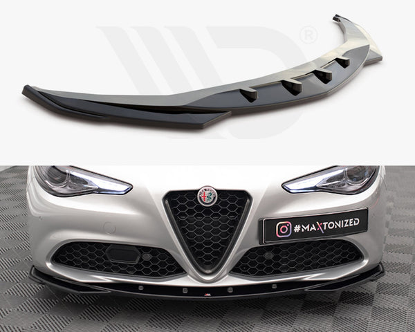 Front splitter displayed above a luxury car bumper installed below headlights and grille, on checkered floor. Text: "#MAXTONIZED" displayed on a black plate with Instagram logo.