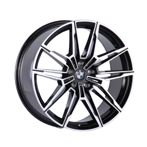 A glossy black and silver car wheel rim displays a dynamic, geometric spoke design with the BMW logo centered. It is isolated against a white background.