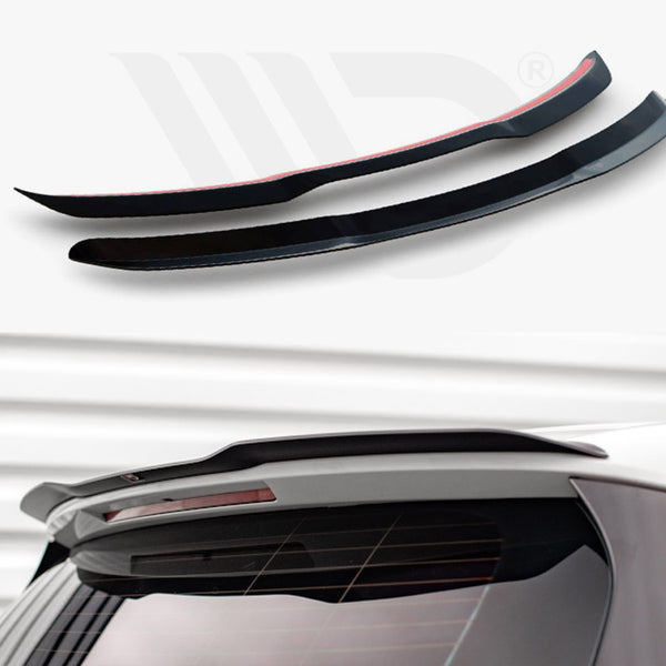 Two black car spoilers, accented with red, rest on a white surface. Below, a spoiler is mounted on a white car's rear against a metallic, ridged background.