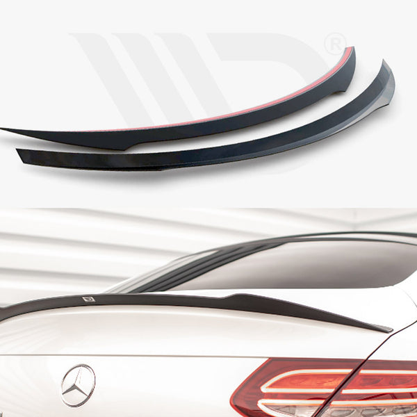 Two black car spoilers, one with a red trim, are displayed against a white background. Below, a white Mercedes with a spoiler is shown in a brightly lit garage.