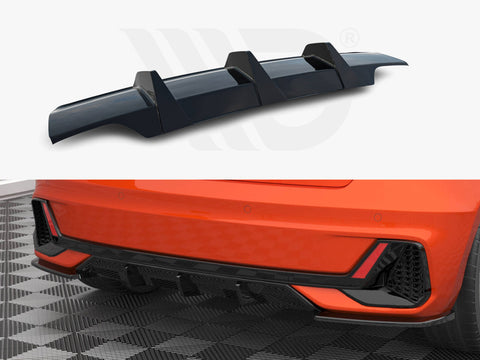 A black car rear diffuser shown separately and installed on an orange car's lower back bumper, displayed on a patterned garage floor, emphasizing aerodynamic style enhancements.