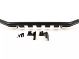 A black metal car bumper bar is placed on a plain surface alongside mounting brackets and small screws, likely intended for vehicle installation.