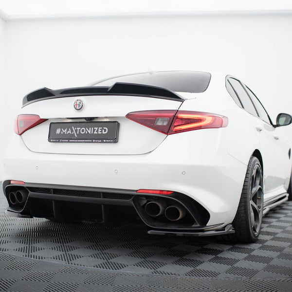 A white sports car is parked in a showroom with a tiled floor, featuring a sleek design and tinted windows. The license plate reads "#MAXTONIZED."