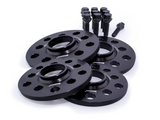 Four black wheel spacers with multiple holes, labeled 