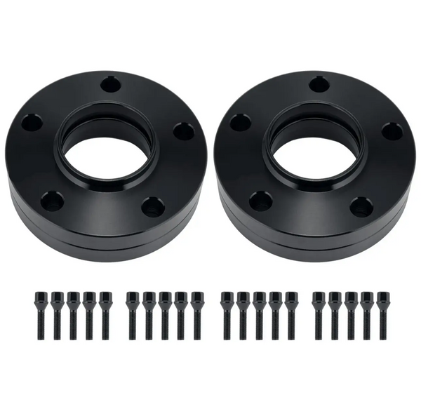 Two black circular wheel spacers with multiple bolt holes are placed side by side. Below each spacer, a row of black bolts and nuts is neatly aligned on a plain white background.