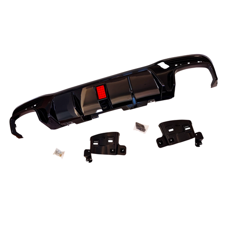 Black automobile bumper with red reflector detail is placed centrally. Additional plastic brackets and small bags likely containing screws are set around it. All items are on a white background.