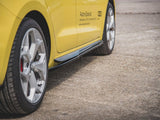 A yellow car's side with silver alloy wheels is parked on concrete. Text reads: 