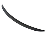 A sleek, curved, black spoiler sits isolated against a white background, suggesting it's an auto accessory designed to enhance vehicle aerodynamics.