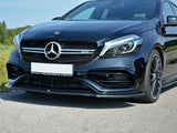 A black Mercedes-Benz car is parked on a road, showcasing its sleek front grille and headlights. Text: 