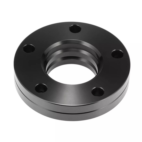 A black, circular metal flange with five evenly spaced bolt holes, features a shiny, grooved surface. It is isolated against a white background, highlighting its industrial design.
