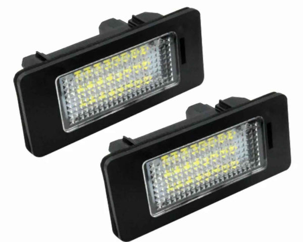 Two rectangular LED lights with black housings, featuring a grid of small yellow diodes. They are positioned diagonally against a plain white background.