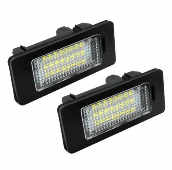 Two rectangular LED lights with black casings, showing multiple small light bulbs, positioned at an angle against a plain white background.