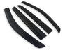 Four sleek, black, curved wind deflectors arranged parallel on a white background.