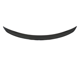 A black, crescent-shaped object curves upward, possibly a car spoiler, set against a plain white background.