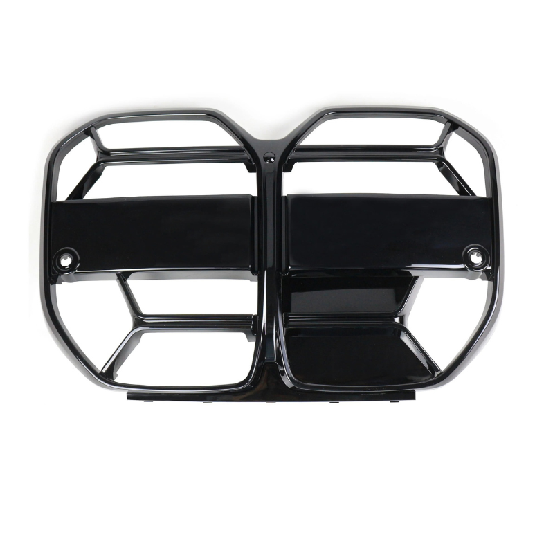A shiny black car grille, divided into two sections with horizontal and vertical slats, rests on a plain white background, designed for ventilation and vehicle styling.