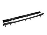 Two black, elongated car side skirts with attachment brackets lie parallel on a white background. The top one is glossy and smooth, while the bottom one has a carbon fiber texture.