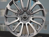 A silver alloy wheel with a multi-spoke design is displayed. The center features the 