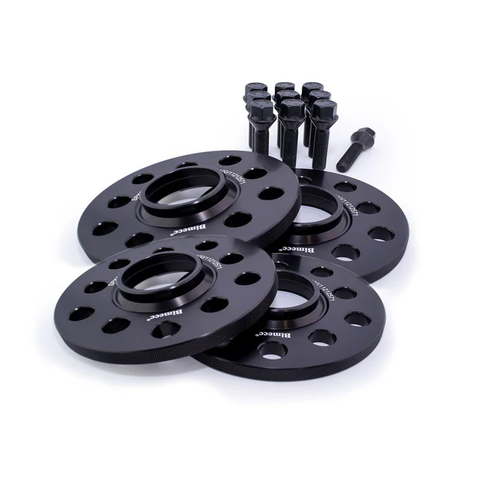 Four black wheel spacers with multiple holes are arranged neatly, accompanied by a set of eight bolts. The spacers are labeled "Bimecc." The background is plain white.