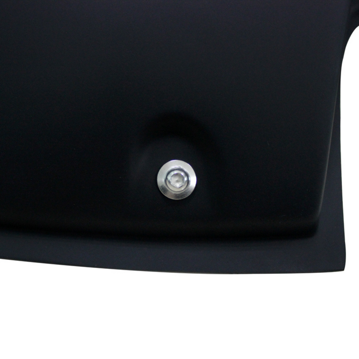 A shiny metal bolt is affixed to a black, matte surface, slightly recessed, with smooth edges and minimal surrounding detail.