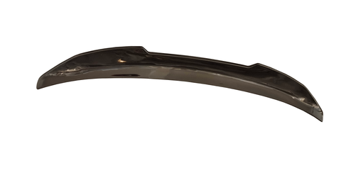 A shiny, curved metal object with a subtle reflective surface, placed against a white background. The object appears smooth and elongated, possibly an automotive or decorative component.