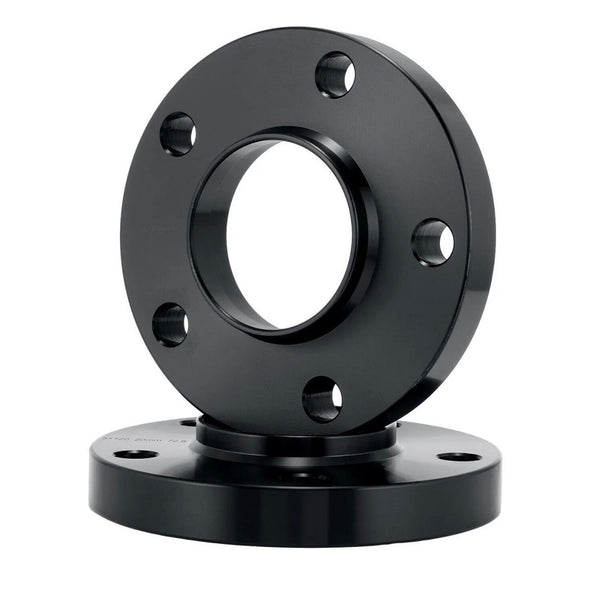 A black cylindrical flange, featuring multiple evenly spaced bolt holes, is positioned vertically on another similar flange, set against a plain white background.