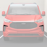 A red car is parked in a parking space, viewed head-on, displaying a large grille and modern headlights. The background shows a concrete wall.
