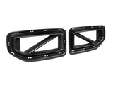 Two carbon fiber car grilles with angular designs, featuring frame cutouts and diagonal supports. Positioned on a plain white background, highlighting their structure and texture.