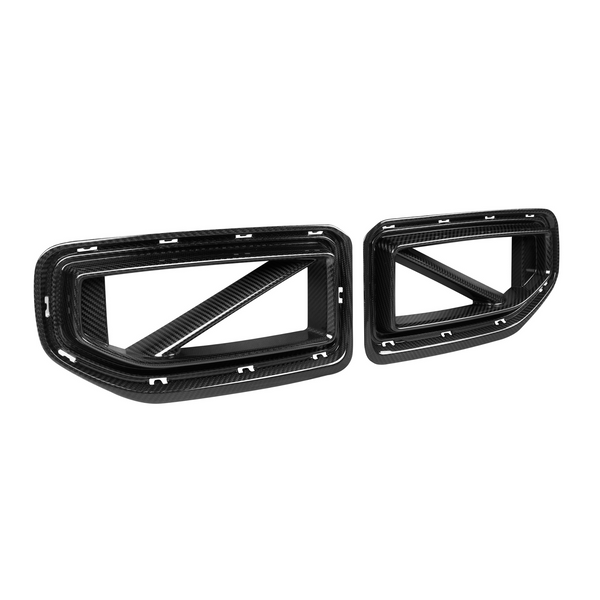 Two carbon fiber car grilles with angular designs, featuring frame cutouts and diagonal supports. Positioned on a plain white background, highlighting their structure and texture.