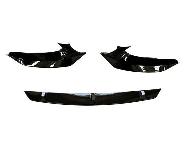 Three glossy black car body parts are displayed against a white background, featuring two angular side components and a straight centerpiece below, resembling a front splitter set.
