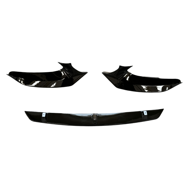 Three glossy black car body parts are displayed against a white background, featuring two angular side components and a straight centerpiece below, resembling a front splitter set.