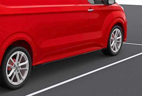 A red van is parked on a dark asphalt surface, with white parking lines visible. The focus is on the side, highlighting its sleek design and silver alloy wheels.