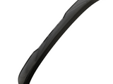 A sleek, curved, black car spoiler rests against a plain white background, showcasing its aerodynamic design and glossy finish.