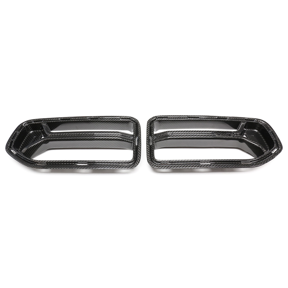 Two carbon fiber exhaust tip covers are displayed side by side on a plain white background, showcasing their sleek, aerodynamic design.