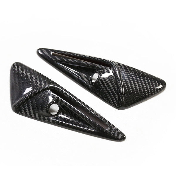 Two carbon fiber car spoiler fins, featuring a sleek design with aerodynamic ridges and mounting holes, sit side by side on a plain white background.