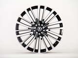 A polished alloy wheel with a modern, multi-spoke design, featuring a 