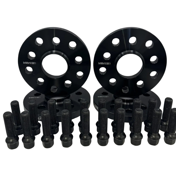 Two black wheel spacers with bolt patterns, surrounded by several black wheel bolts, are arranged on a white background. Text on spacers reads "5x100 & 5x112 CB57.1".