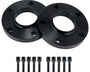 Two black wheel spacers lie side-by-side, each with five evenly spaced holes. Below them, ten matching black bolts are aligned neatly, on a plain white background.