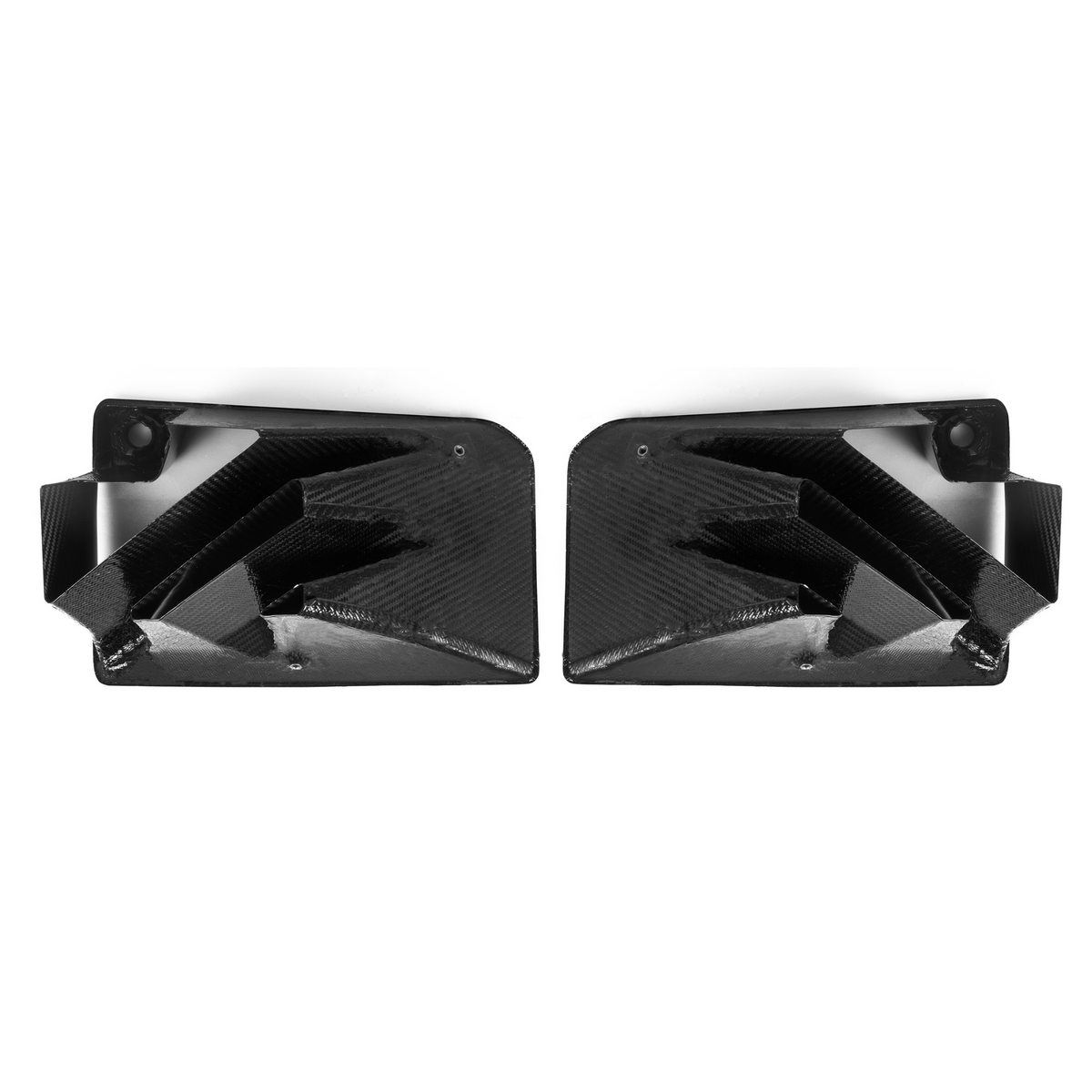 Two black carbon fiber air vents are positioned side by side, facing inward. They feature geometric, angular designs with a sleek, glossy finish, set against a plain white background.