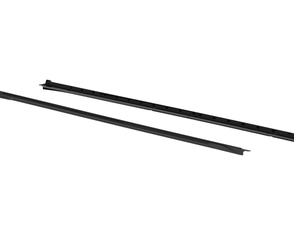 Two long, black plastic rails are placed parallel to each other on a white background, each with a series of evenly spaced grooves.