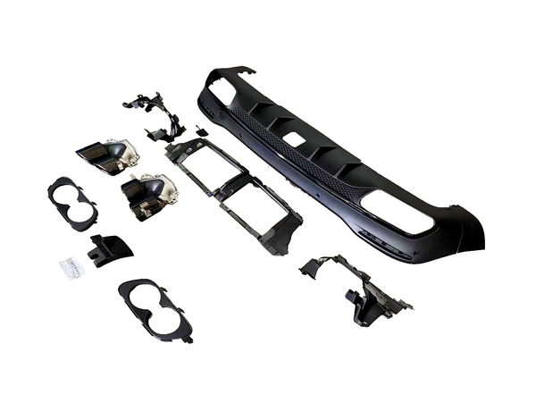 Auto body kit components are arranged on a white surface, including a bumper and grille sections, headlight housings, and various brackets, providing parts for vehicle modification and repair.