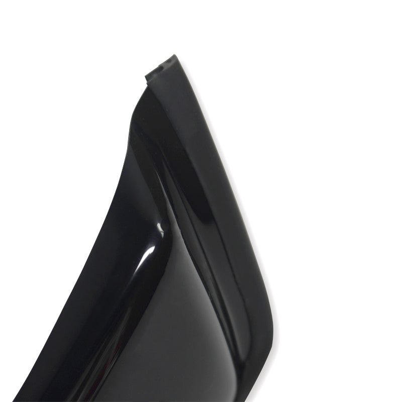 A glossy black high-heeled shoe with a sharp heel edge is positioned against a plain white background. The focus is on the rear and top section of the heel.