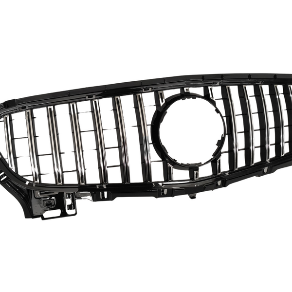 Car grille with vertical chrome slats and a central circular emblem cutout, set against a white background.